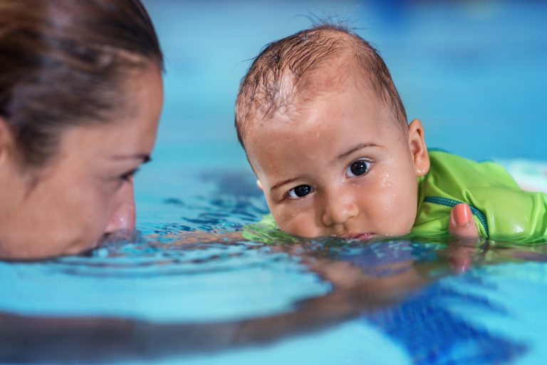 Mother With Baby Boy In The Swimming Pool On Swimming Class