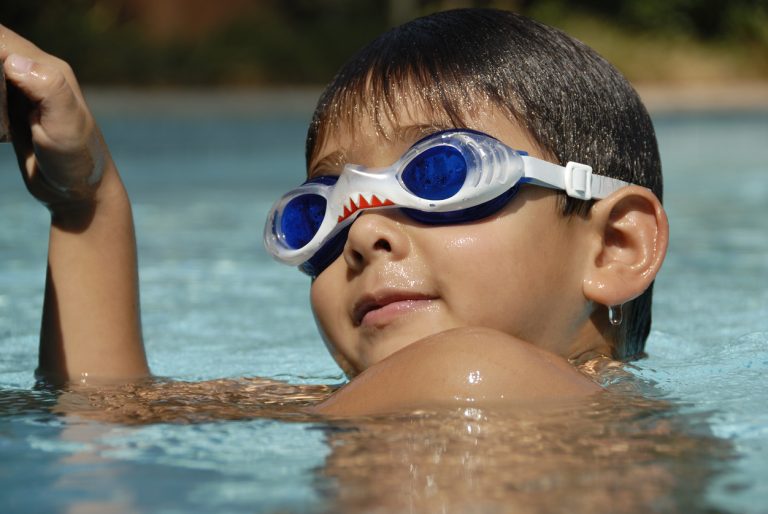 5 Year Old With Goggles In The Pool