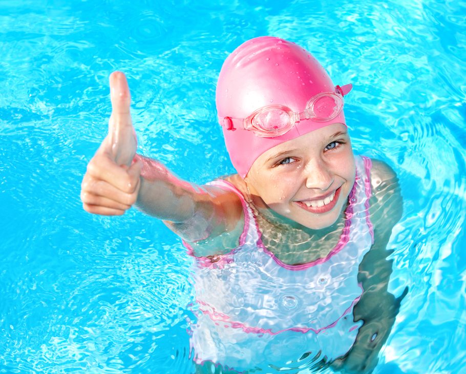 Child Swimming In Pool.