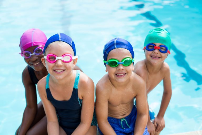 Little Swimmers Sitting At Poolside